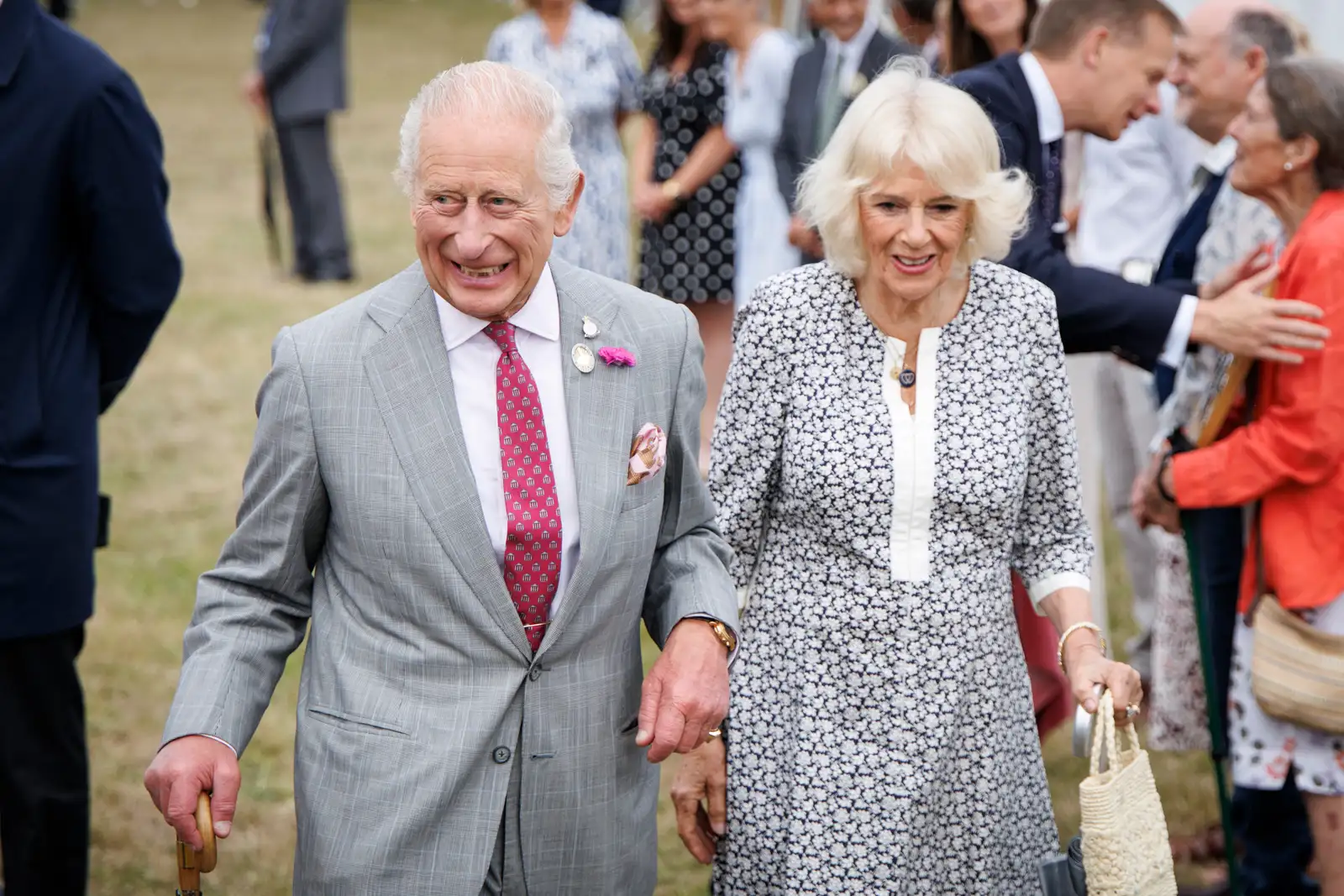 epa12255750 Britain's King Charles III (C-L) and Britain's Queen Camilla (C-R) arrive during their visit to the Sandringham Flower Show at Sandringham House in Norfolk, Britain, 23 July 2025. Sandringham Flower Show is a one-day show that attracts around 20,000 visitors each year, with many of East Anglia's leading horticultural specialists participating in the event.  EPA/TOLGA AKMEN
