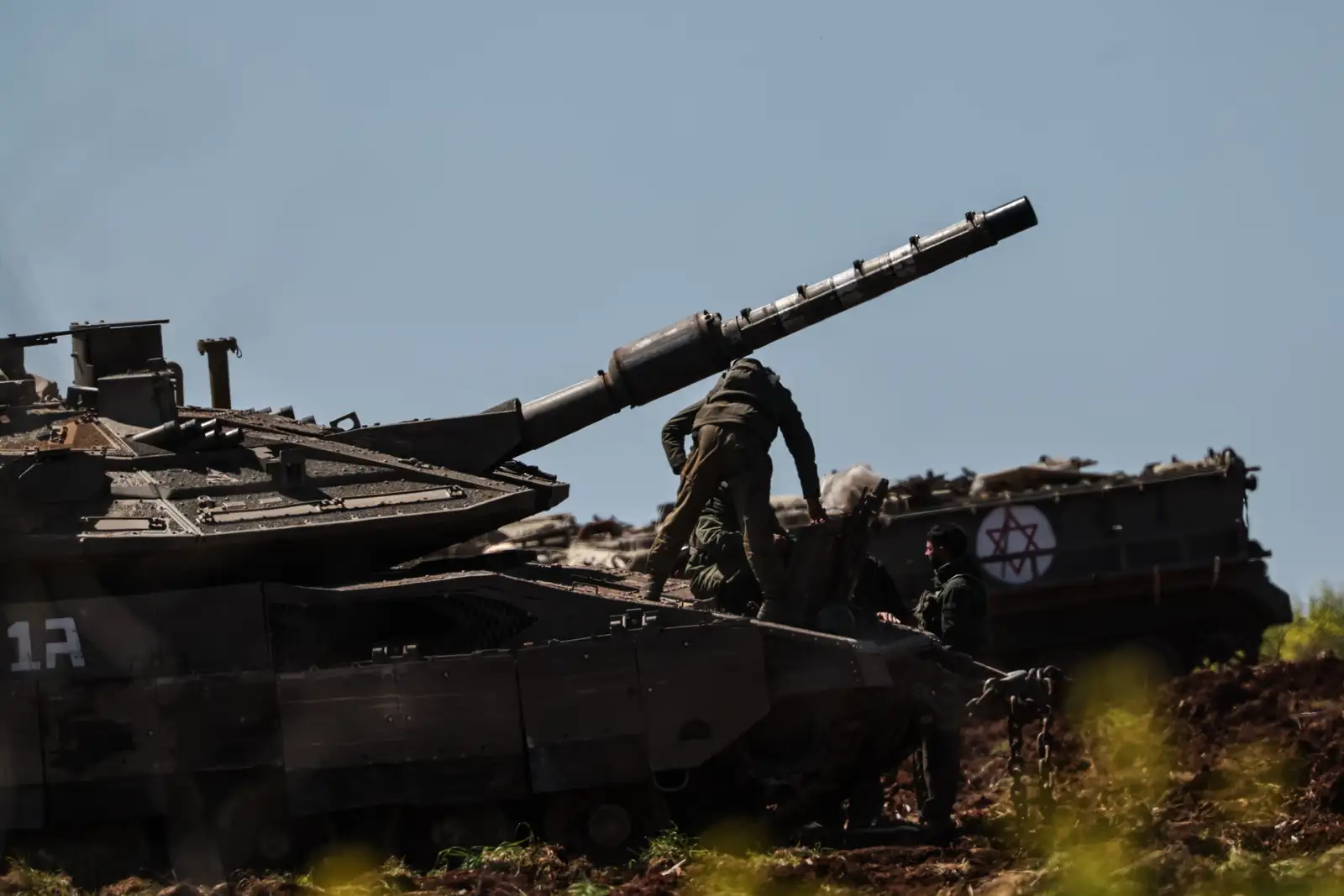 epa12805892 Israeli tanks are deployed at a military outpost along the border with Lebanon, 09 March 2026. The Israeli military stated it is conducting strikes across Lebanon targeting Hezbollah infrastructure and personnel.  EPA/ATEF SAFADI