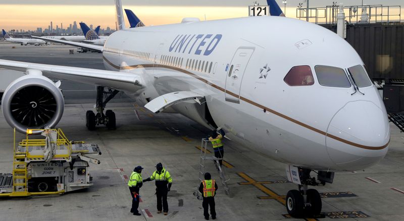 FILE- In this Jan. 7, 2019, file photo a Dreamliner 787-10 arriving from Los Angeles pulls up to a gate in Newark Liberty International Airport in Newark, N.J. United Airlines reports financial results Tuesday, Jan. 15. (AP Photo/Seth Wenig, File)