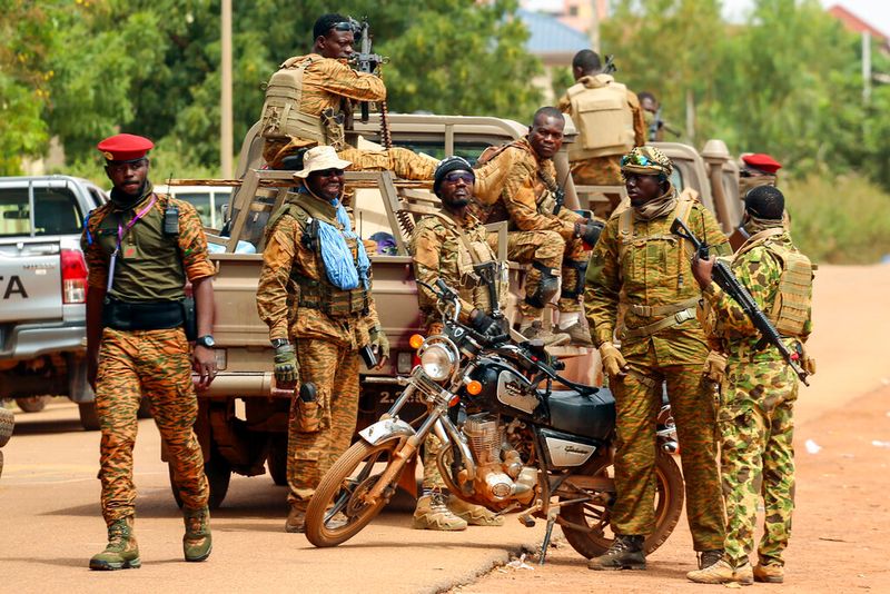 Soldiers loyal to Burkina Faso's latest coup leader Capt. Ibrahim Traore gather outside the National Assembly as Traore was appointed Burkina Faso's transitional president in Ouagadougou, Burkina Faso, Friday Oct. 14, 2022. (AP Photo/Kilaye Bationo)