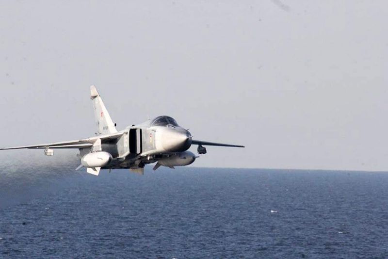 epa05257625 A handout image made available on 13 April 2016 by the US Navy shows A Russian Sukhoi Su-24 attack aircraft makes a low altitude pass by USS Donald Cook (DDG 75) in the Baltic Sea, 12 April 2016. Donald Cook, an Arleigh Burke-class guided