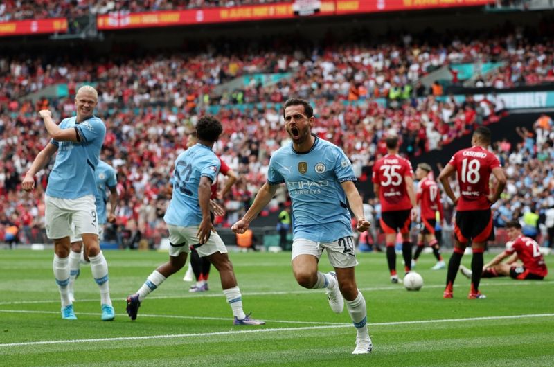 Man City’s Bernado Silva celebrates after scoring the 1-1 tieagainst Man Utd during the FA Community Shield between Manchester City and Manchester United at Wembley Stadium in London, Britain, 10 August 2024.